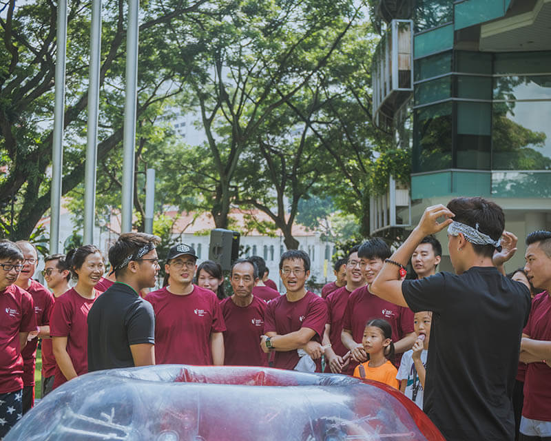 Bubble Soccer players meeting in a controlled challenge