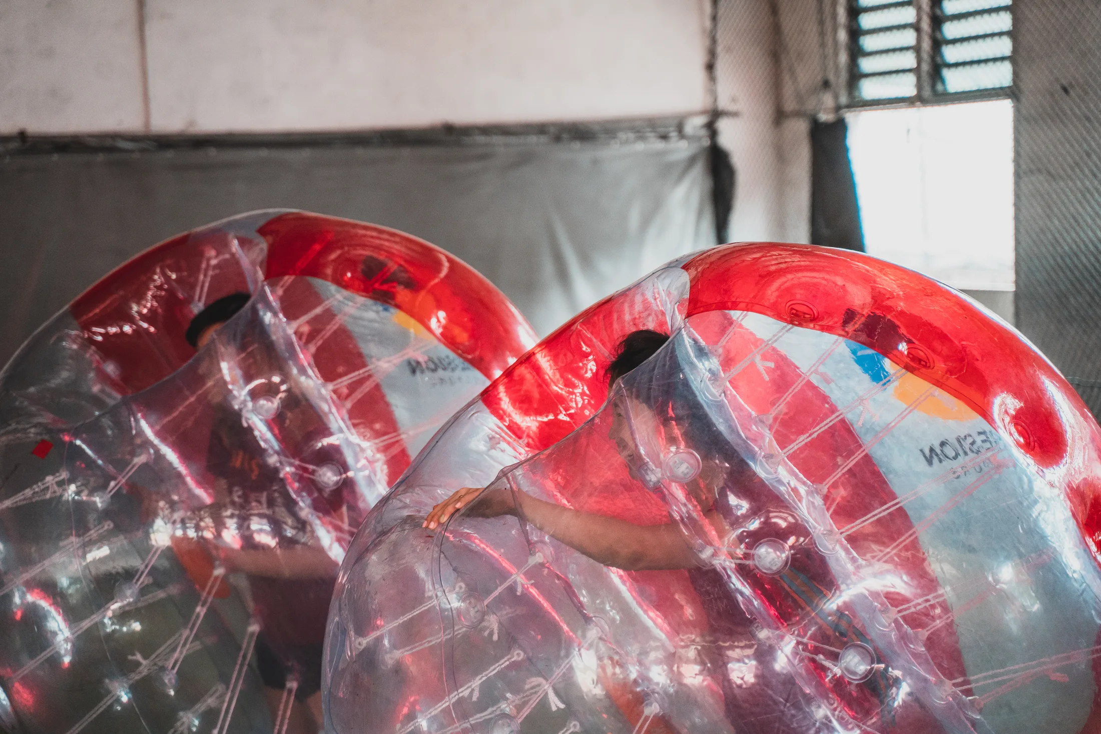Bubble Soccer players inside inflatable suits during a hosted session